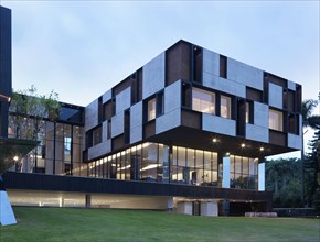 Front exterior modern building with geometric pattern at dusk