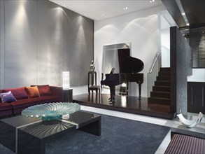 Modern living room with baby grand piano