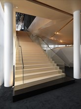 Large modern staircase with glass hand rail