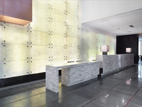 Marble reception desk in modern lobby