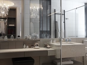 Simple modern bathroom with elegant chandelier
