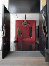 Modern entrance foyer with red wall