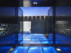 Modern entrance with blue illuminated floor