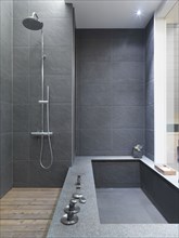 Modern black slate bathtub and shower
