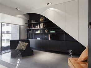 Modern style office with bookshelf and love seat