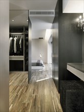 Closet area of master bedroom with hardwood floors