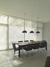 Dining room in modern home with black table and chairs
