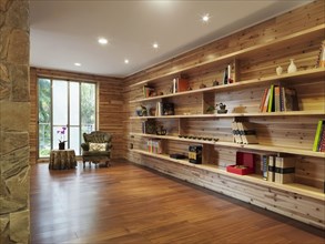 Sitting room with long bookshelf in cabin