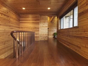 Hardwood hallway in cabin style home