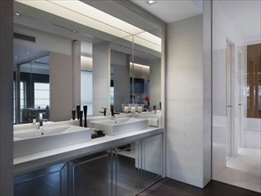 Modern bathroom with large mirrors