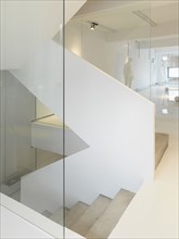 White staircase in modern home