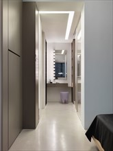 Hallway to vanity in modern home
