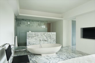 Large bathtub in marble bathroom