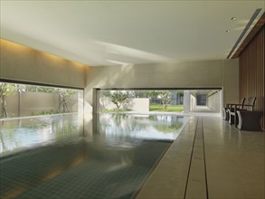 Indoor swimming pool with large windows