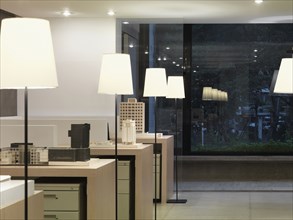 Repetitive lamps in modern office at night