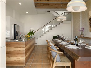 Large wooden dining table in kitchen