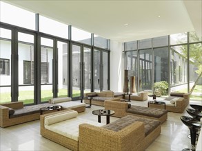 Wicker furniture in large modern sunroom