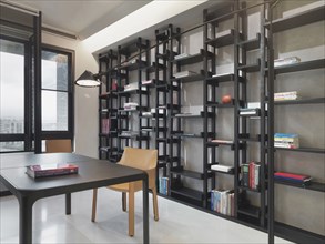 Floor to ceiling bookcase in home office