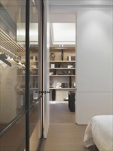 Closet in bedroom with glass walls