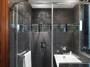 Black tile glass shower