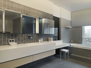 Modern bathroom with long countertop
