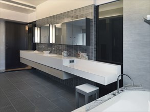 Modern bathroom with long countertop
