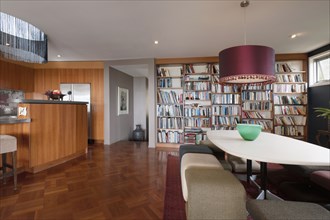 Dining area and library in contemporary house