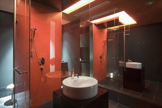 Interior of lit modern bathroom at spa