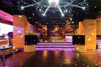 Disco ball over dance floor in nightclub