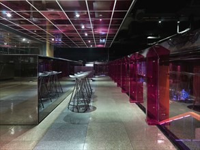 Bar counter and stools in modern nightclub