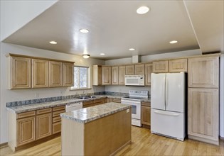 Kitchen island and cabinets in house