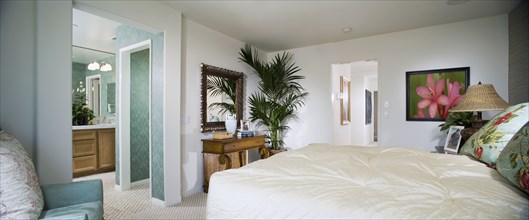 White Master bedroom and turquoise bathroom