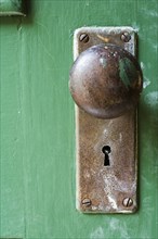 Old Doorknob on Green Door
