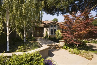 Front walkway and landscaping to Spanish style home