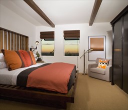 Cozy Bedroom with Terra Cotta Colored Comforter