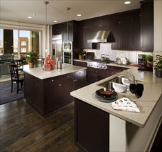Brown wooden cabinets in contemporary kitchen