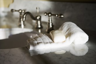 Traditional Bathroom Counter and Faucet with Towel and Soap bar
