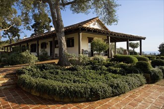 Exterior of Spanish Style Home and Landscape
