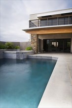 Rear Exterior of Modern Home and Swimming Pool