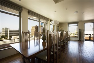 Modern dining room table with view of city.