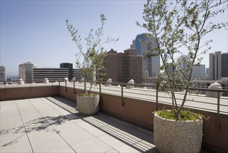 Outdoor patio with view of city.