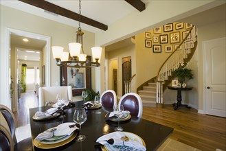 Dining area with staircase in background.