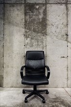 Detail of a lone leather office chair