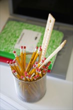 Full pencil container on desk