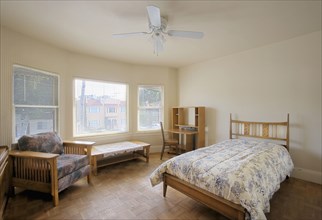 Sparse bedroom with a large window