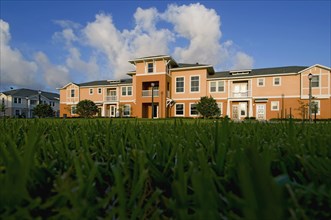 View of apartment complex from grass