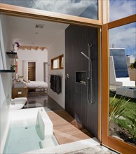 Master bathroom and bedroom in modern eco friendly home