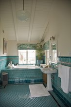 Traditional bathroom with turquoise tiles