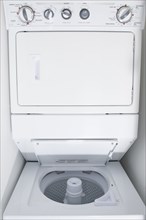 Close up of empty stacking washing machine and dryer