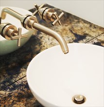 Close up of sink and faucet in modern bathroom